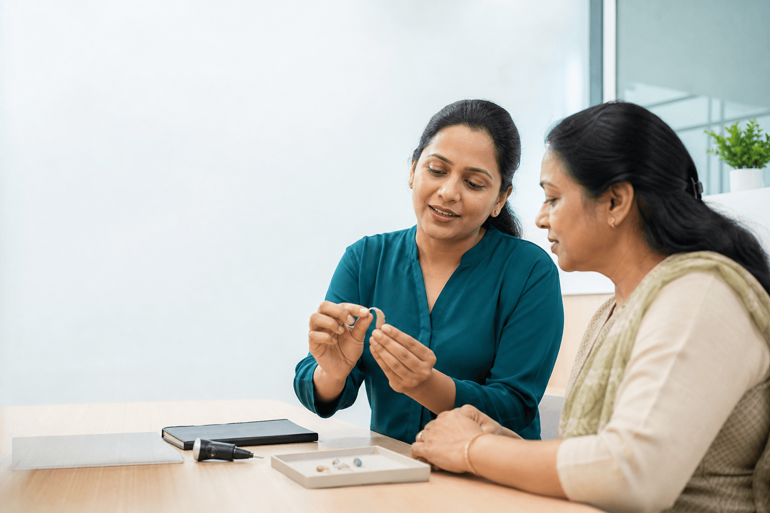 Illustrative hearing-aid maintenance conversation between two adults
